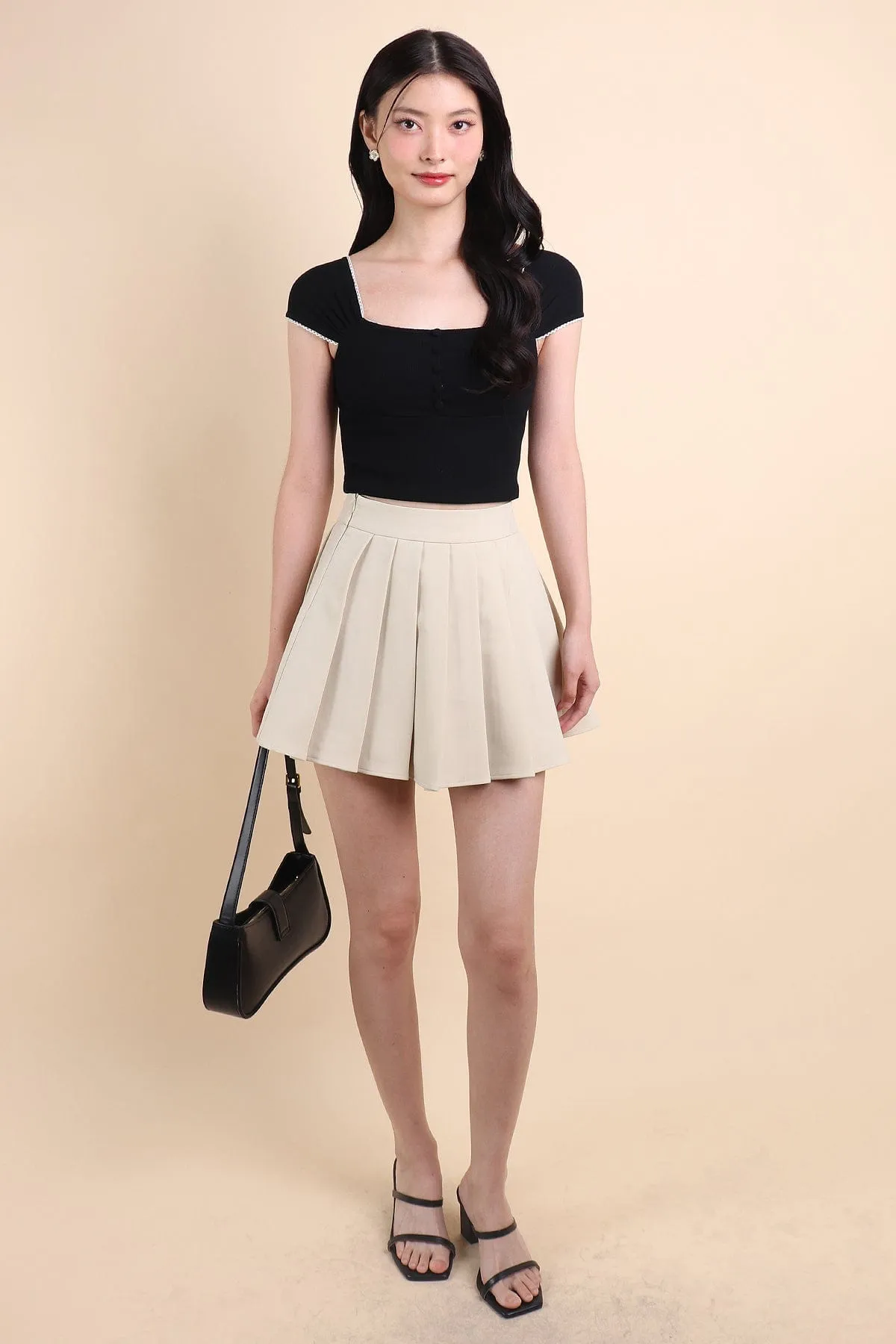 CAMU PLEATED SKIRT IN ECRU