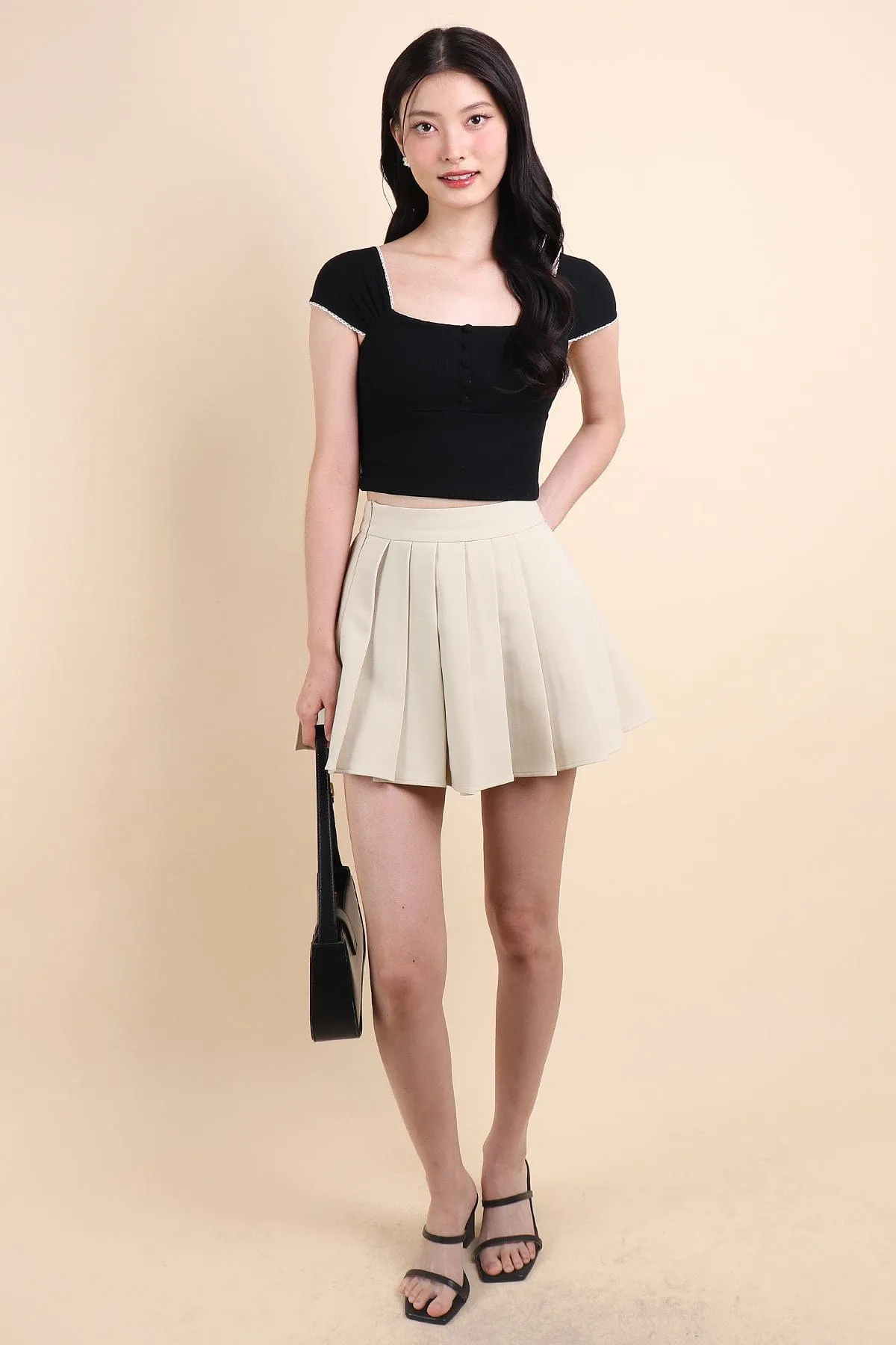 CAMU PLEATED SKIRT IN ECRU