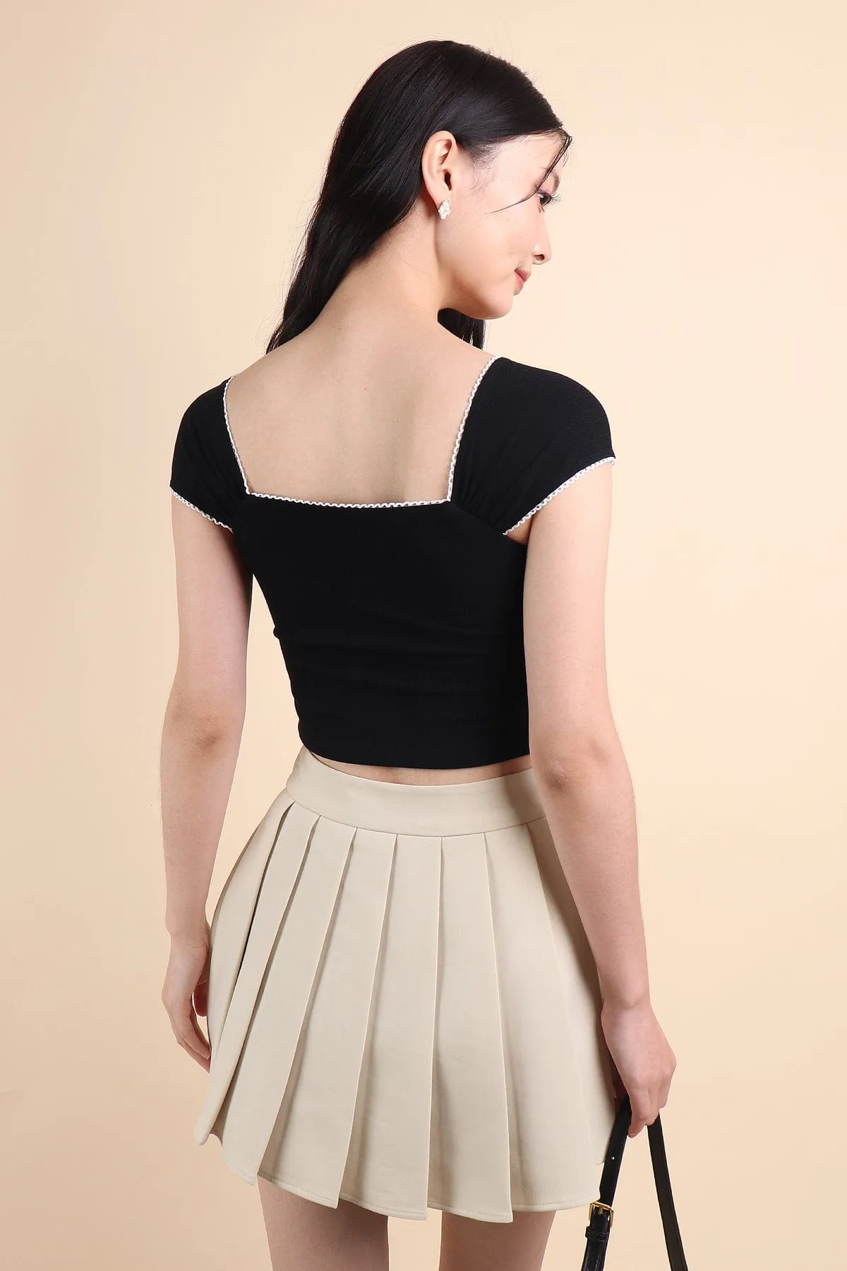 CAMU PLEATED SKIRT IN ECRU